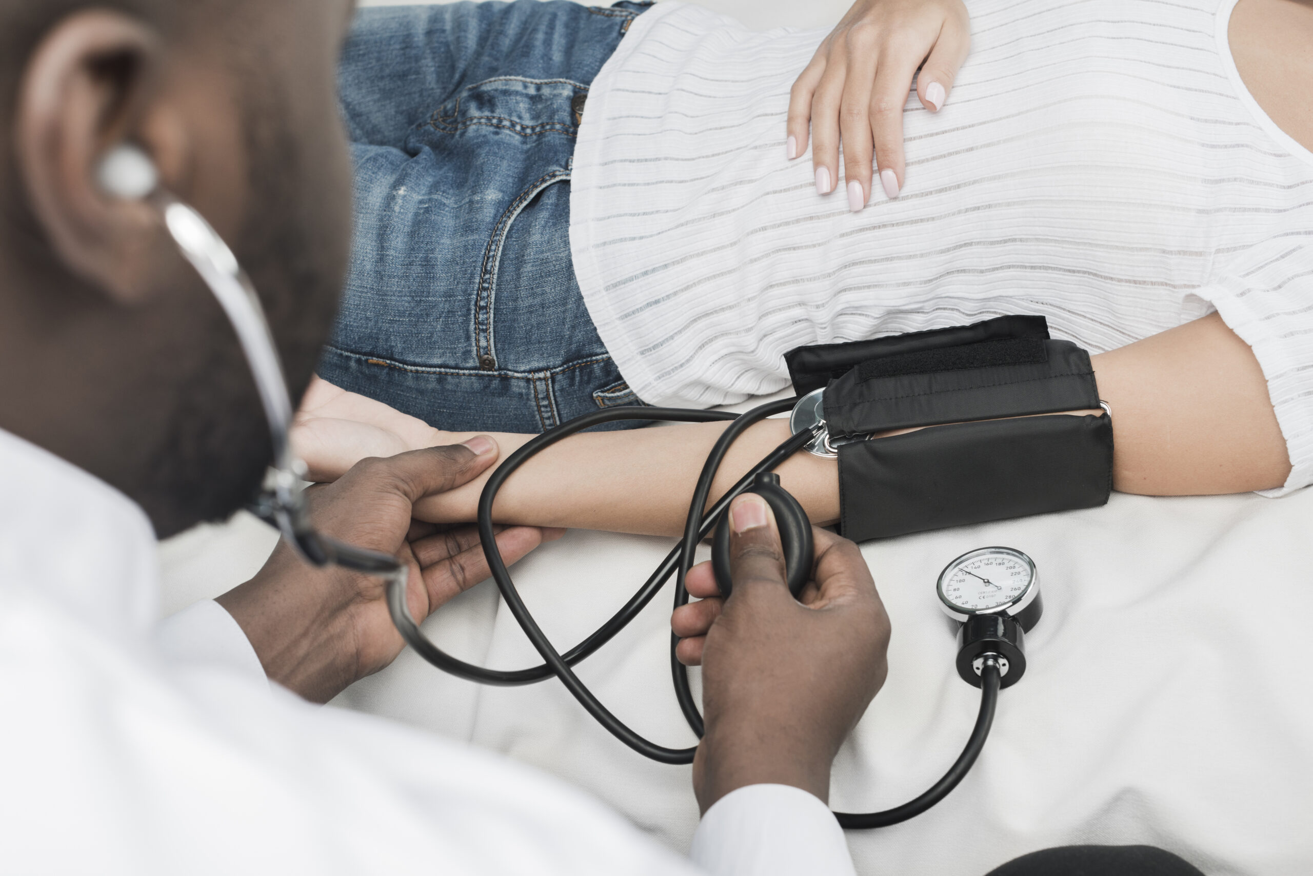 Healthcare professional measuring blood pressure